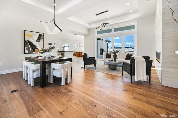 Dining room, Fireplace, Interior, Living room, Pendant Lights, Recessed Lighting, Wood Texture Flooring
