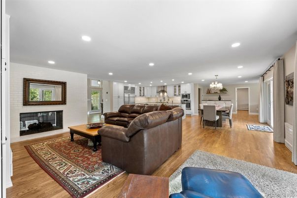 Chandelier, Dining room, Fireplace, Interior, Kitchen, Living room, Recessed Lighting, Stainless Steel Appliances, Wood Texture Flooring