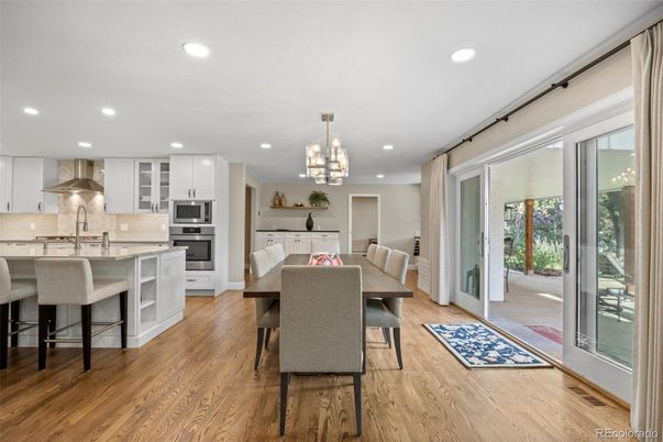 Chandelier, Dining room, Interior, Kitchen, Pendant Lights, Recessed Lighting, Stainless Steel Appliances, Wood Texture Flooring