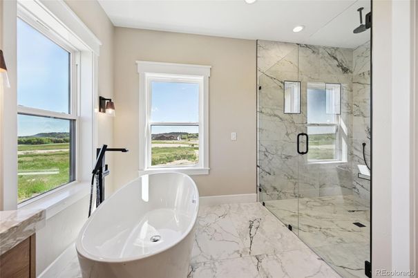 Bathroom, Free Standing Baths, Glass Shower, Interior, Marble, Marble Walls, Recessed Lighting, Water