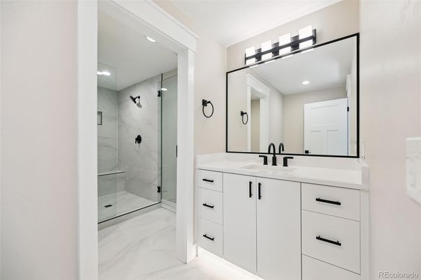 Bathroom, Dual Sink Vanities, Glass Shower, Interior, Marble, Marble Walls, Recessed Lighting