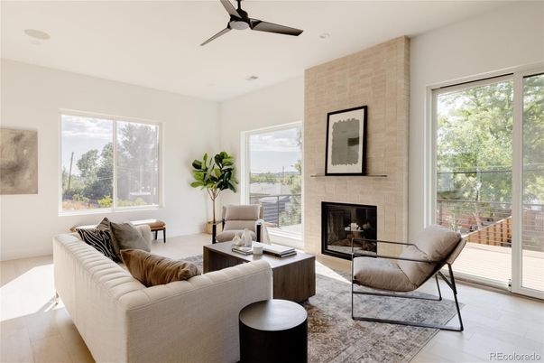 Fireplace, Interior, Living room, Recessed Lighting, Stone Walls, Wood Texture Flooring