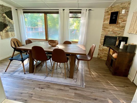 Dining room, Fireplace, Interior, Stone Walls, Wood Texture Flooring