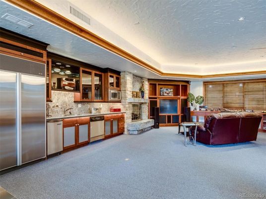 Fireplace, Interior, Kitchen, Living room, Recessed Lighting, Stainless Steel Appliances, Stone Walls
