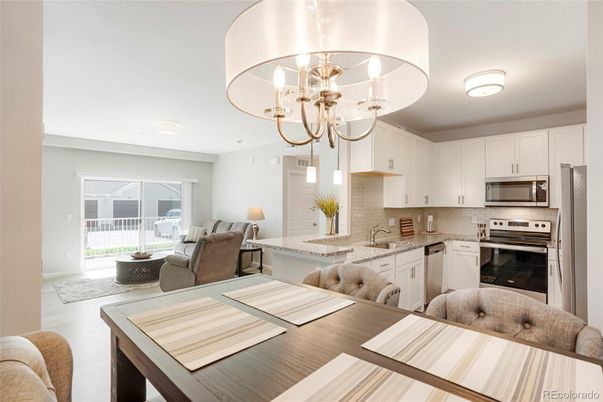 Chandelier, Dining room, Interior, Kitchen, Living room, Stainless Steel Appliances, Wood Texture Flooring