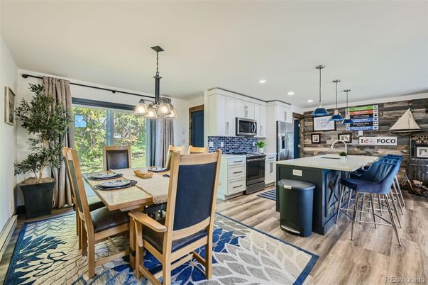 Dining room, Interior, Kitchen, Pendant Lights, Recessed Lighting, Stainless Steel Appliances, Wood Texture Flooring
