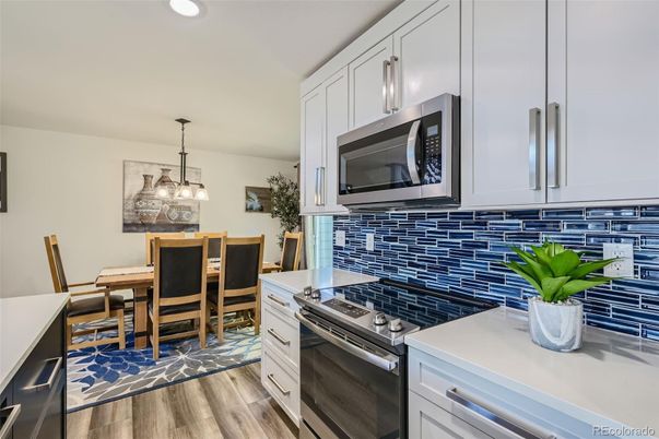 Dining room, Interior, Kitchen, Pendant Lights, Recessed Lighting, Stainless Steel Appliances, Wood Texture Flooring