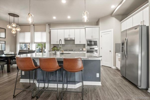 Dining room, Interior, Kitchen, Pendant Lights, Recessed Lighting, Stainless Steel Appliances, Wood Texture Flooring