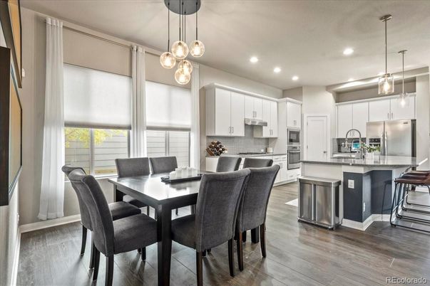 Dining room, Interior, Kitchen, Pendant Lights, Recessed Lighting, Stainless Steel Appliances, Wood Texture Flooring