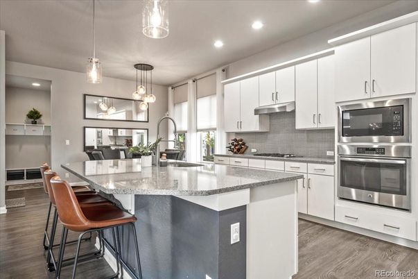 Dining room, Interior, Kitchen, Pendant Lights, Recessed Lighting, Stainless Steel Appliances, Wood Texture Flooring