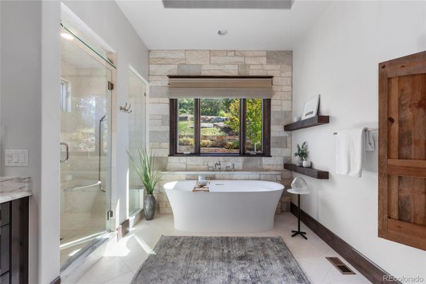 Bathroom, Free Standing Baths, Glass Shower, Interior, Recessed Lighting, Stone Walls