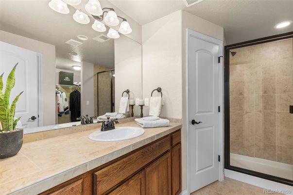 Bathroom, Dual Sink Vanities, Glass Shower, Interior, Recessed Lighting, Tile Countertops