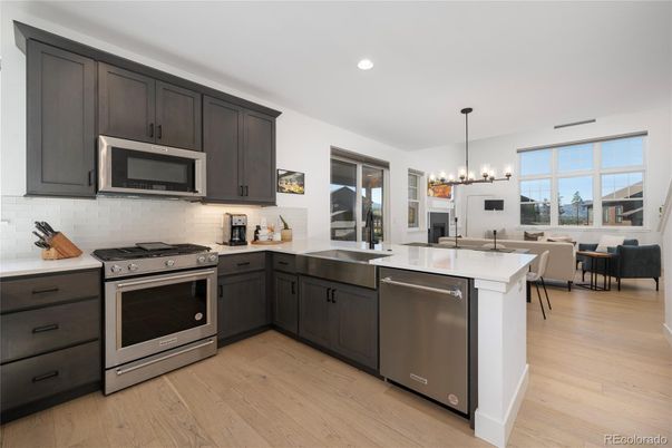 Dining room, Interior, Kitchen, Pendant Lights, Recessed Lighting, Stainless Steel Appliances, Wood Texture Flooring