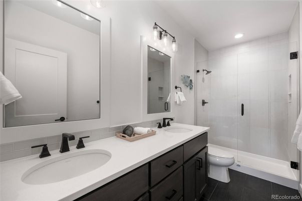 Bathroom, Dual Sink Vanities, Glass Shower, Interior, Recessed Lighting, Wood Texture Flooring