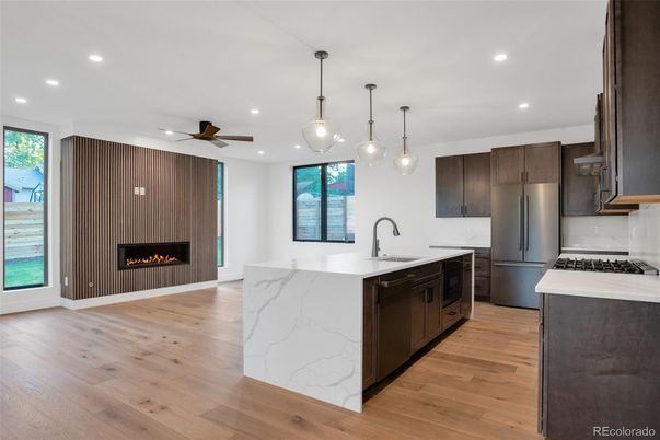 Fireplace, Interior, Kitchen, Pendant Lights, Recessed Lighting, Stainless Steel Appliances, Wood Texture Flooring