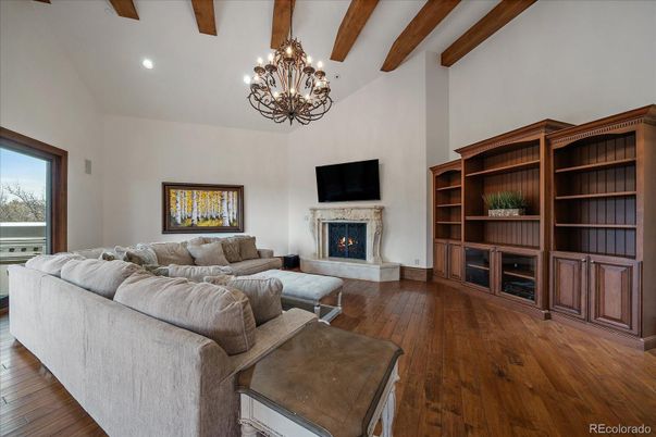 Chandelier, Fireplace, Interior, Living room, Recessed Lighting, Wooden Beams, Wood Texture Flooring
