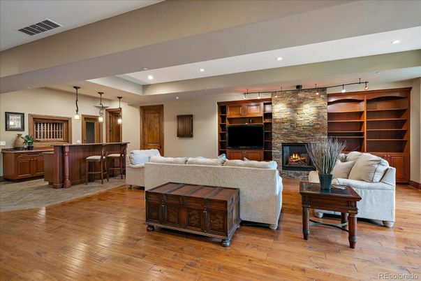 Fireplace, Interior, Living room, Pendant Lights, Recessed Lighting, Stone Walls, Wood Texture Flooring