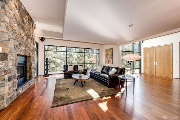 Fireplace, Interior, Living room, Pendant Lights, Recessed Lighting, Stone Walls, Wood Texture Flooring