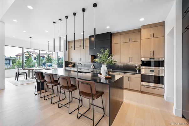 Dining room, Interior, Kitchen, Pendant Lights, Recessed Lighting, Stainless Steel Appliances, Wood Texture Flooring