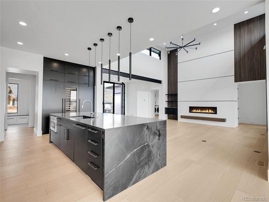 Fireplace, Interior, Kitchen, Pendant Lights, Recessed Lighting, Stainless Steel Appliances, Wood Texture Flooring