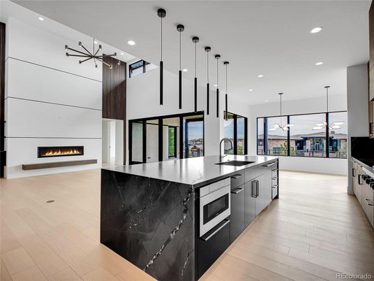 Fireplace, Interior, Kitchen, Pendant Lights, Recessed Lighting, Stainless Steel Appliances, Wood Texture Flooring