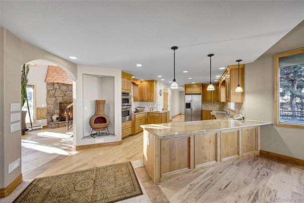 Fireplace, Interior, Kitchen, Pendant Lights, Recessed Lighting, Stainless Steel Appliances, Wood Texture Flooring