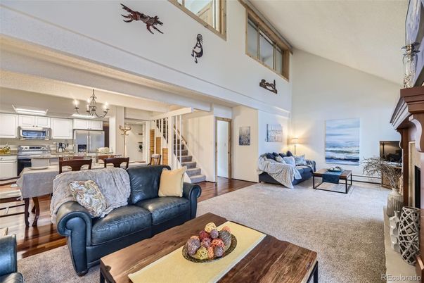 Chandelier, Dining room, Interior, Kitchen, Living room, Stainless Steel Appliances, Wood Texture Flooring