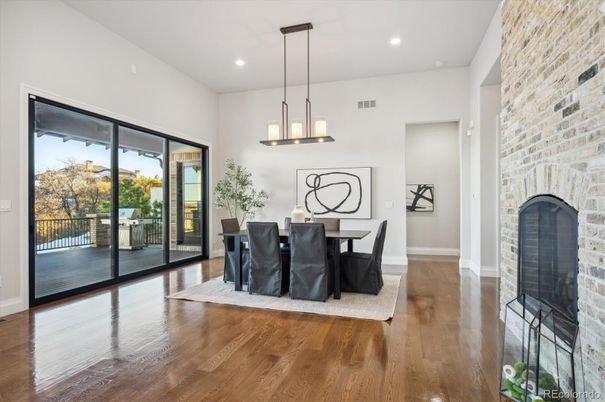 Dining room, Fireplace, Interior, Pendant Lights, Recessed Lighting, Stone Walls, Wood Texture Flooring