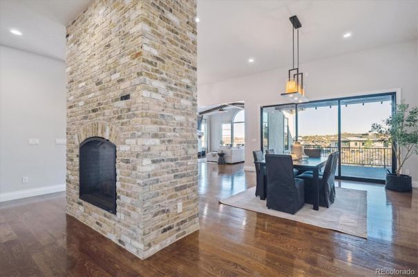 Dining room, Fireplace, Interior, Pendant Lights, Recessed Lighting, Stone Walls, Wood Texture Flooring