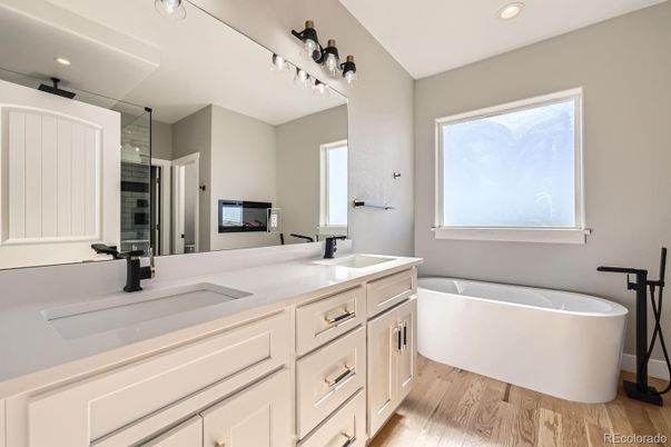 Bathroom, Dual Sink Vanities, Free Standing Baths, Interior, Recessed Lighting, Wood Texture Flooring