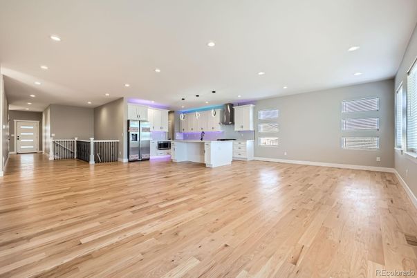 Empty room, Interior, Kitchen, Recessed Lighting, Stainless Steel Appliances, Wood Texture Flooring