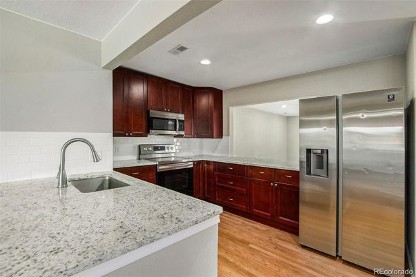 Interior, Kitchen, Recessed Lighting, Stainless Steel Appliances, Wood Texture Flooring