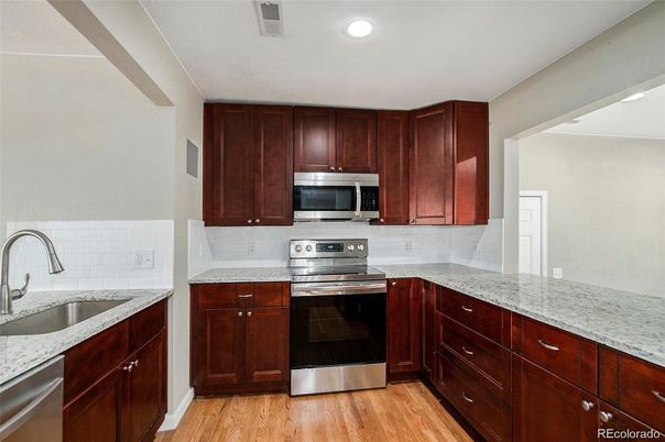 Interior, Kitchen, Recessed Lighting, Stainless Steel Appliances, Wood Texture Flooring