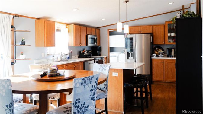 Dining room, Interior, Kitchen, Pendant Lights, Recessed Lighting, Stainless Steel Appliances, Wood Texture Flooring