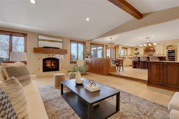 Chandelier, Dining room, Fireplace, Interior, Kitchen, Living room, Pendant Lights, Recessed Lighting, Stainless Steel Appliances, Wooden Beams, Wood Texture Flooring