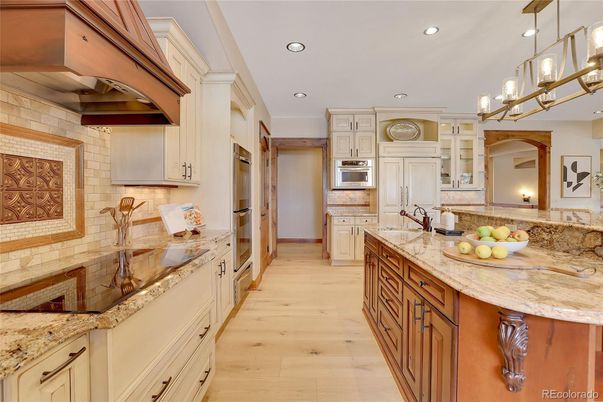 Interior, Kitchen, Pendant Lights, Recessed Lighting, Stainless Steel Appliances, Stone Walls, Wood Texture Flooring
