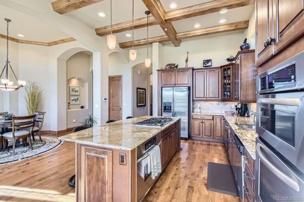 Chandelier, Dining room, Interior, Kitchen, Pendant Lights, Recessed Lighting, Stainless Steel Appliances, Wooden Beams, Wood Texture Flooring