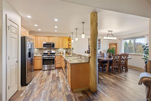 Dining room, Interior, Kitchen, Pendant Lights, Recessed Lighting, Stainless Steel Appliances, Wood Texture Flooring