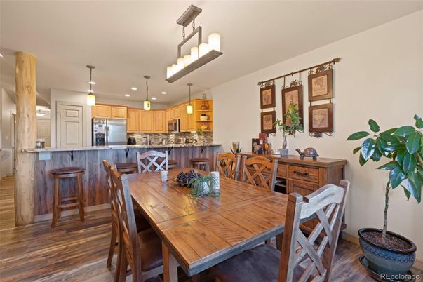 Dining room, Interior, Kitchen, Pendant Lights, Recessed Lighting, Stainless Steel Appliances, Wood Texture Flooring