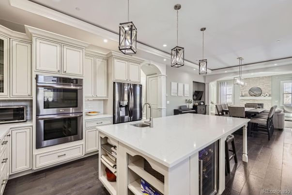 Dining room, Fireplace, Interior, Kitchen, Living room, Pendant Lights, Recessed Lighting, Stainless Steel Appliances, Stone Walls, Wood Texture Flooring