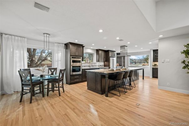 Dining room, Interior, Kitchen, Pendant Lights, Recessed Lighting, Stainless Steel Appliances, Wood Texture Flooring