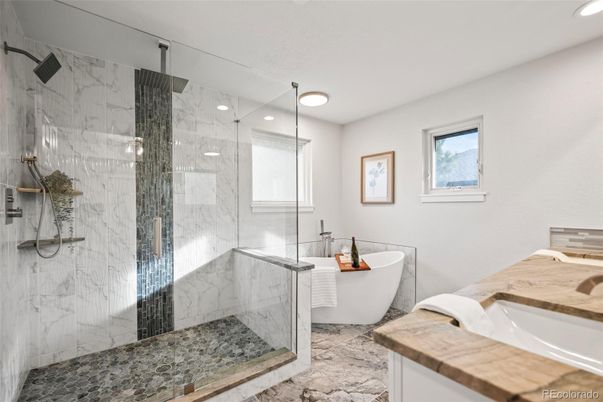 Bathroom, Dual Sink Vanities, Free Standing Baths, Glass Shower, Interior, Marble Walls, Recessed Lighting