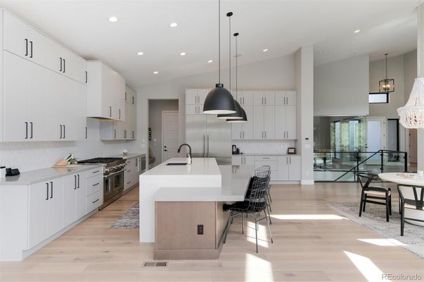 Dining room, Interior, Kitchen, Pendant Lights, Recessed Lighting, Stainless Steel Appliances, Wood Texture Flooring