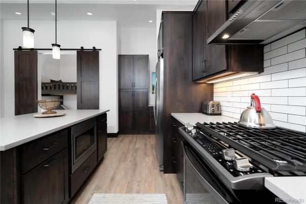 Interior, Kitchen, Pendant Lights, Recessed Lighting, Stainless Steel Appliances, Wood Texture Flooring
