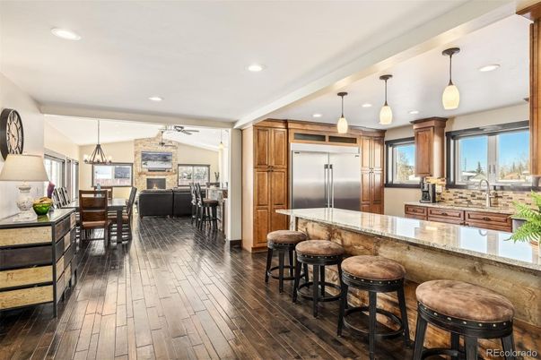 Dining room, Fireplace, Interior, Kitchen, Living room, Pendant Lights, Recessed Lighting, Stainless Steel Appliances, Wood Texture Flooring