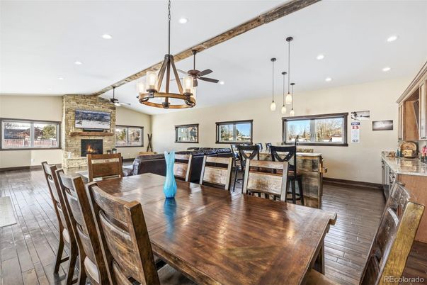 Dining room, Fireplace, Interior, Living room, Pendant Lights, Recessed Lighting, Stone Walls, Wood Texture Flooring
