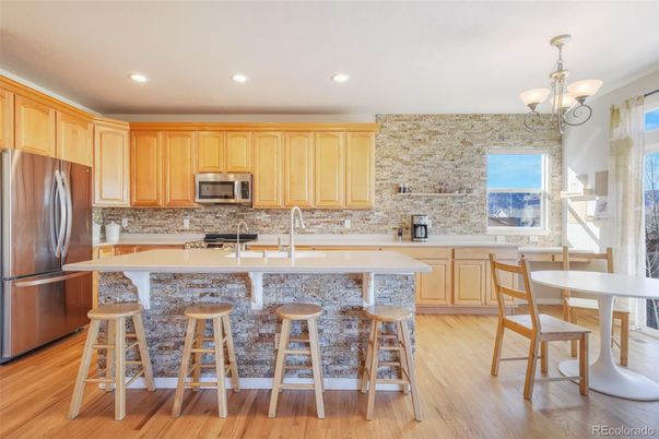 Dining room, Interior, Kitchen, Pendant Lights, Recessed Lighting, Stainless Steel Appliances, Stone Walls, Wood Texture Flooring