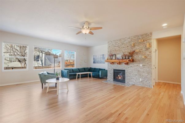 Fireplace, Interior, Living room, Recessed Lighting, Stone Walls, Wood Texture Flooring