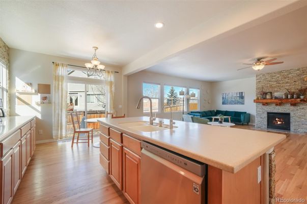 Dining room, Fireplace, Interior, Kitchen, Living room, Recessed Lighting, Stone Walls, Wood Texture Flooring