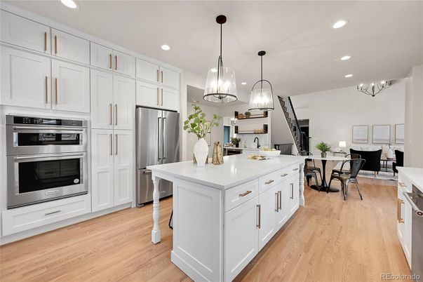 Chandelier, Dining room, Interior, Kitchen, Pendant Lights, Recessed Lighting, Stainless Steel Appliances, Wood Texture Flooring